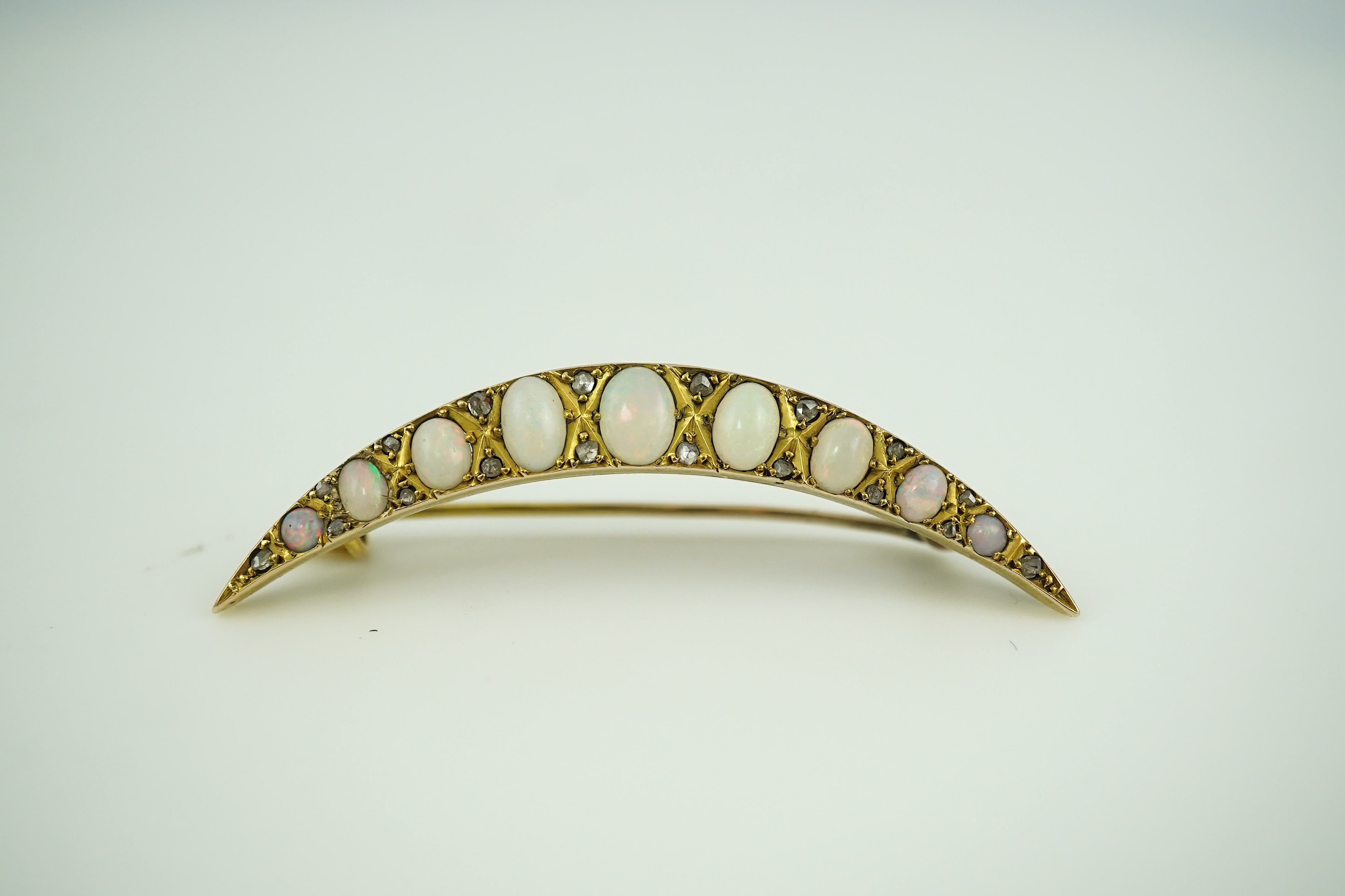 An opal and diamond brooch, early 20th century